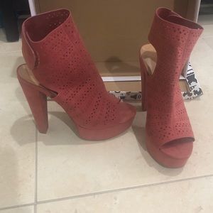A pair of bamboo platform heels with a Velcro backing. Worn once.